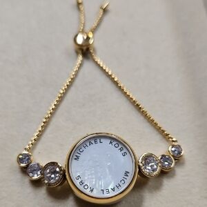 Michael Kors Varick Tracker Slide Bracelet W/ Mother of pearl face.